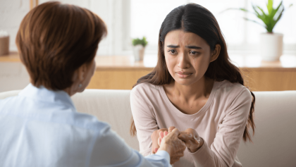 A female therapist is working with a client in session.
